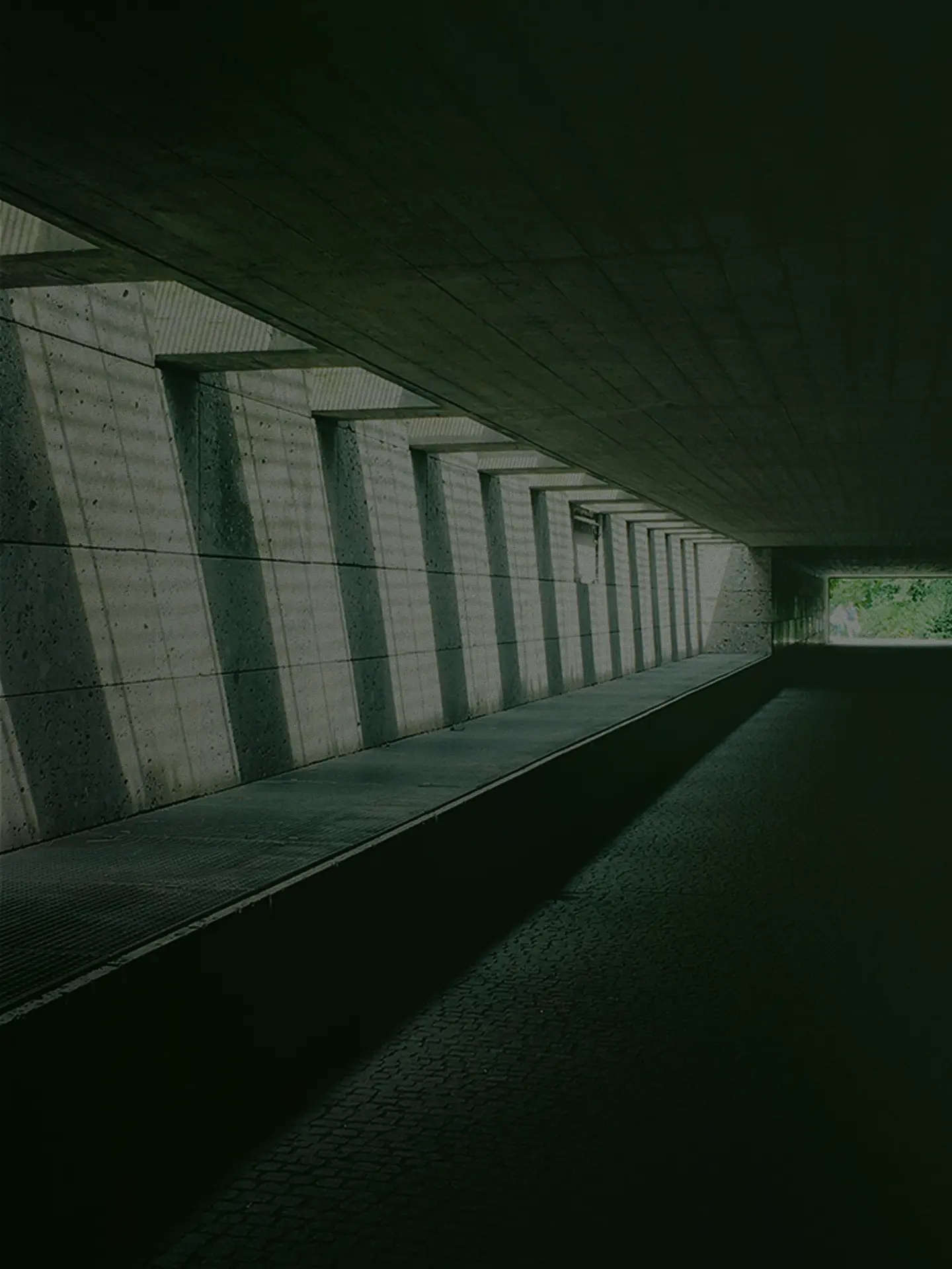 Concrete pedestrian tunnel with repeating structural supports